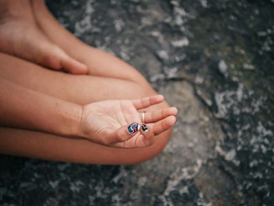 Close-up of hands in a mudra position during meditation.